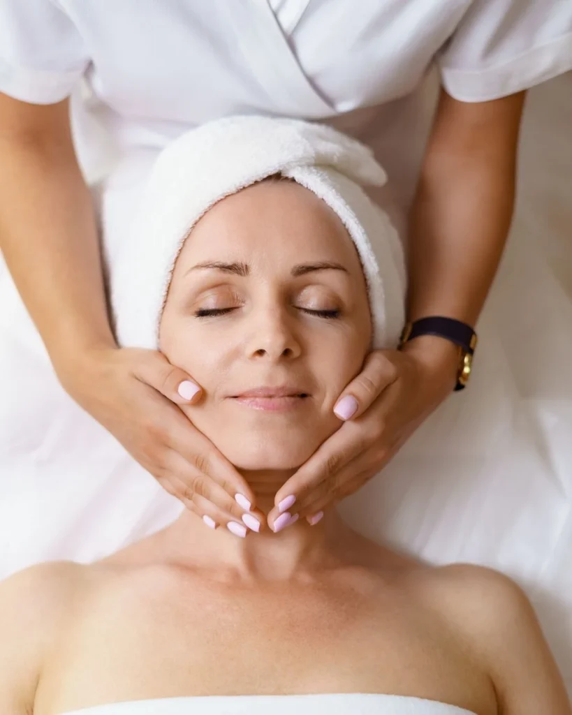Woman receiving an advanced facial treatment at a Dallas skincare spa